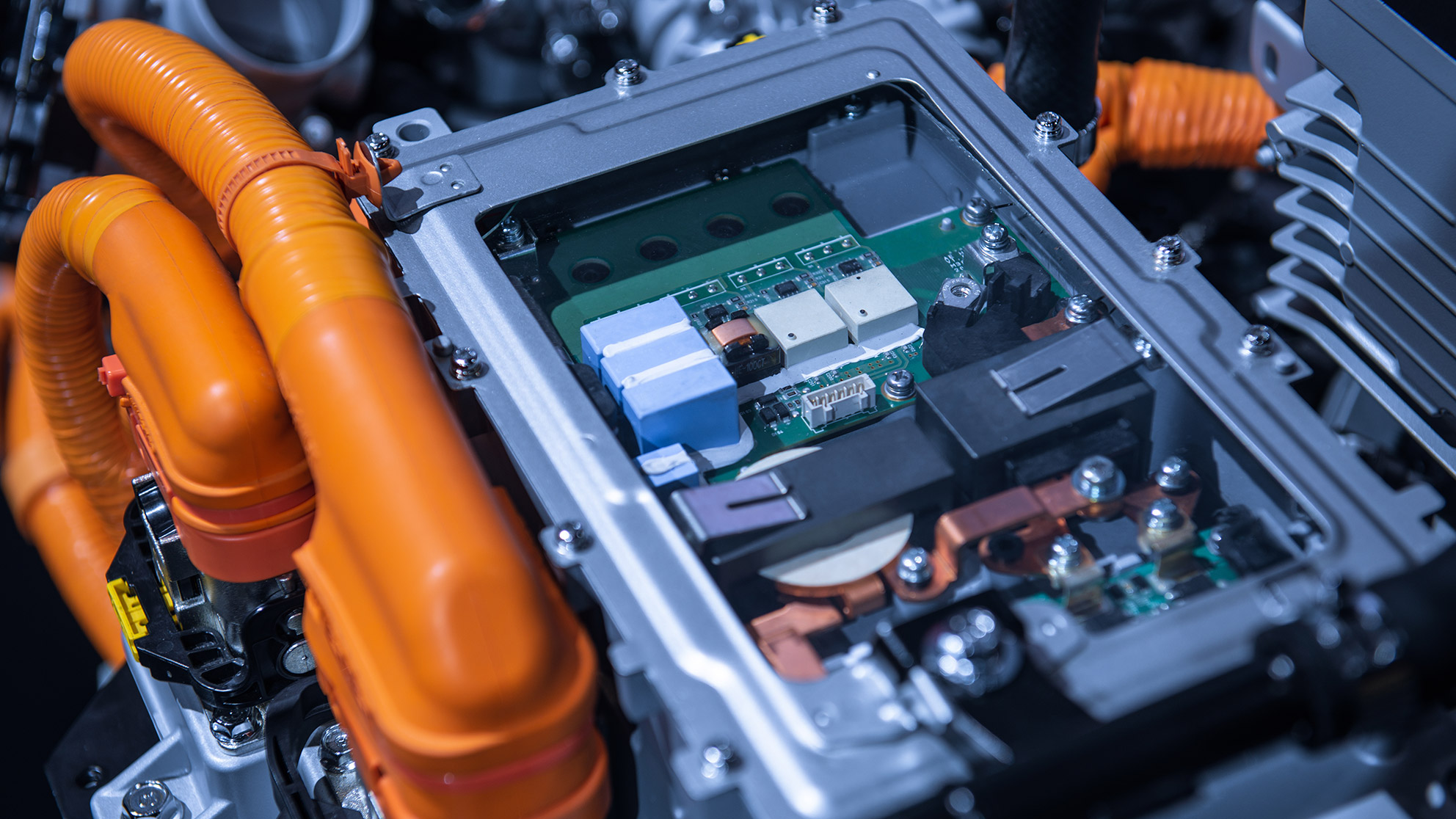 Mix of electronic connections of batteries and tubes of an electric car in close-up