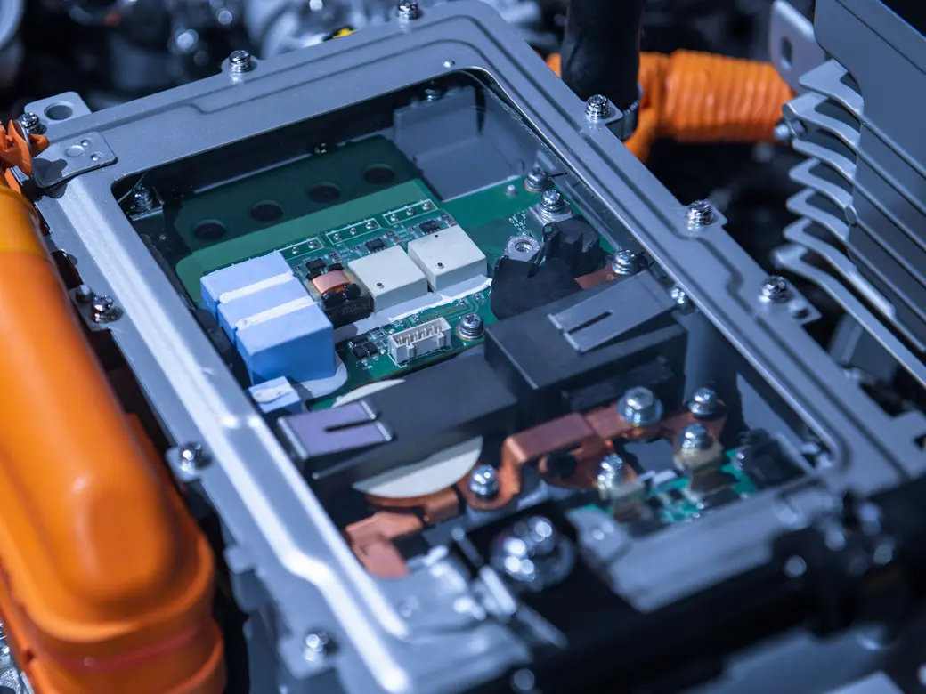 Mix of electronic connections of batteries and tubes of an electric car in close-up